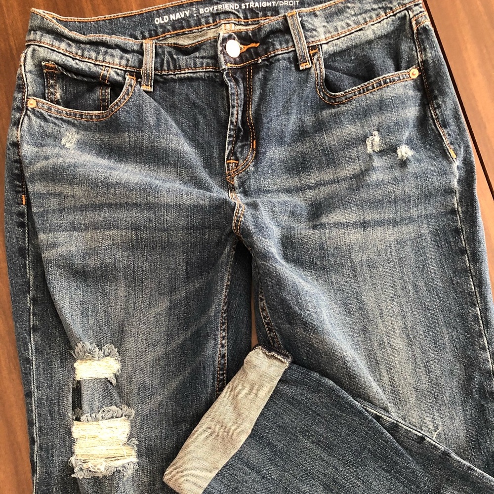 Oversized, boyfriend cut. Cuffed with distressing